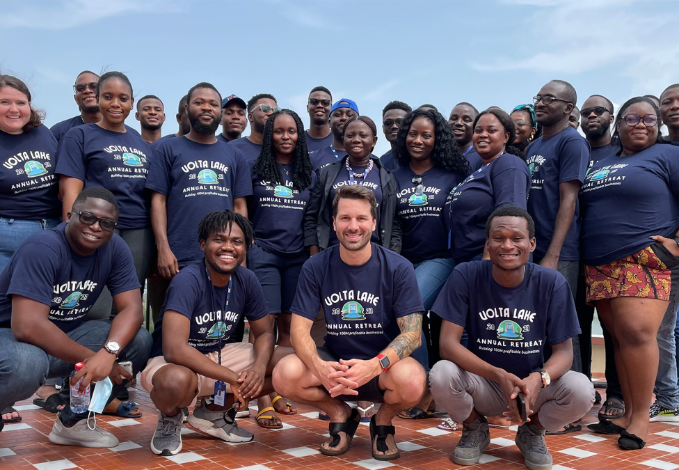 An image of a diverse group of people wearing matching shirts for "Oze". Oze Oze enables banks to lend to small businesses digitally, and is a winner of the Milken Motsepe Prize program.