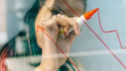 someone writing on glass 