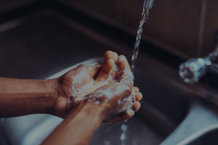 closeup of hands of person washing their hands