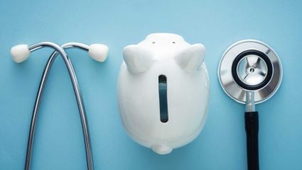 piggy bank and stethoscope