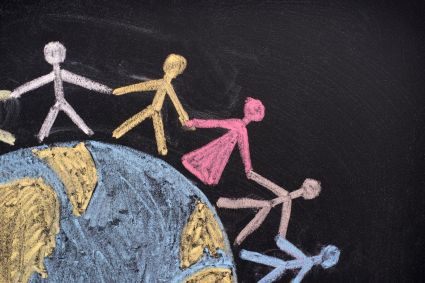 A set of chalk drawings of people holding hands around a globe