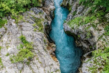 A river running through a rock crevice 