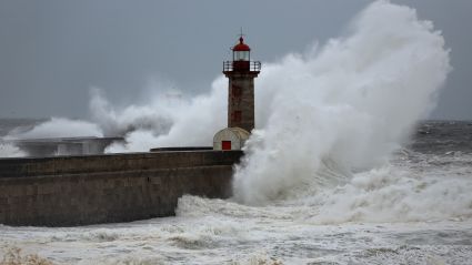 A lighthouse with waves crashing around it