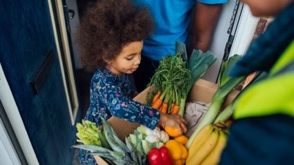 young girl going through grocery basket