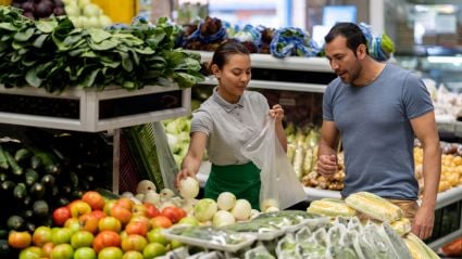 two people shopping in produce section