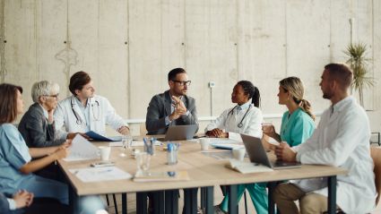 a group of people sitting around a table