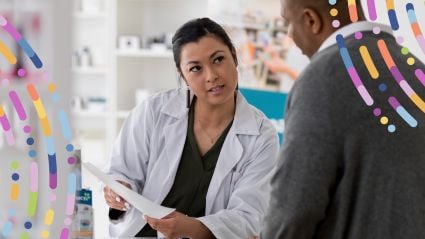 A pharmacist in a white lab coat consults with a patient, holding a clipboard and speaking attentively. They are in a modern pharmacy setting, with medication shelves visible in the background. Colorful abstract graphics overlay the image, symbolizing innovation and access in healthcare.