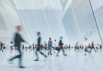 blurred image of people walking