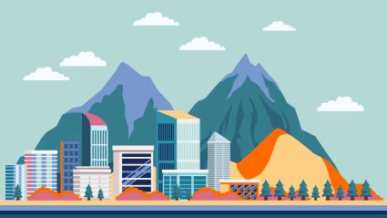 An image of a city surrounded by mountains.