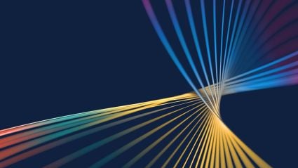 Abstract converging colored lines radiating from a central focal point on a dark blue background.