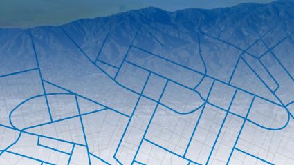 Architectural blueprint with building floor plans against mountain backdrop