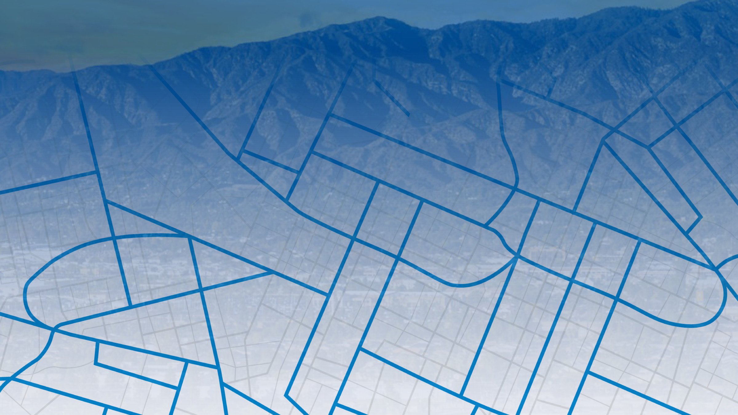 Architectural blueprint with building floor plans against mountain backdrop
