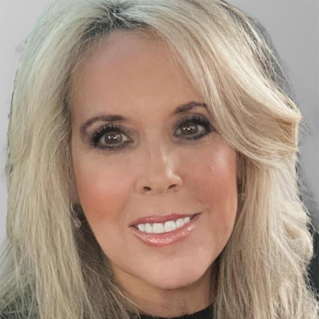 An image of a woman named Cheryl Evans who is Director, Milken Institute Finance. She has light white skin, light blonde hair, and brown eyes and she is smiling at the camera.