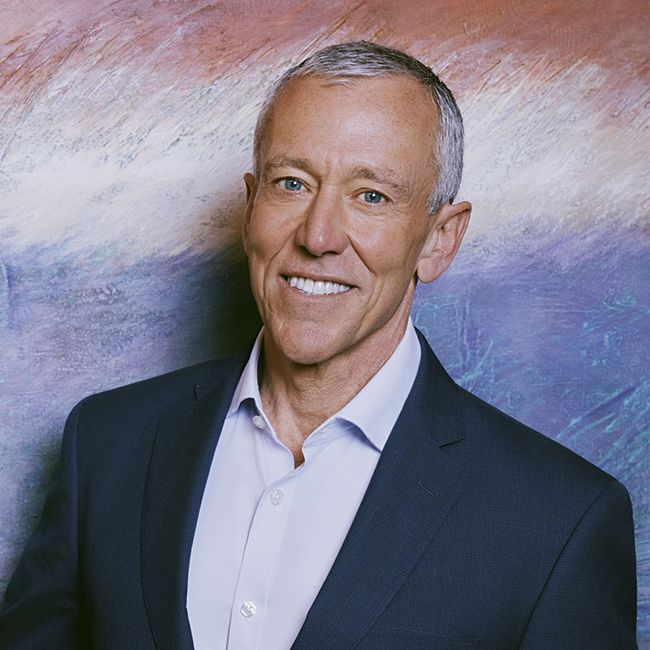 Richard Ditzio, CEO of Milken Institute against blue and white abstract background