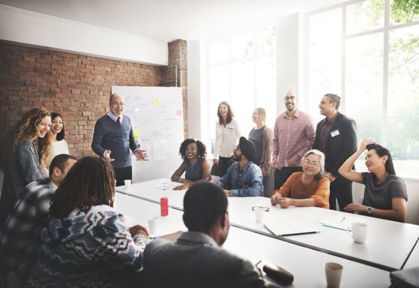 Employees around a table collaborating