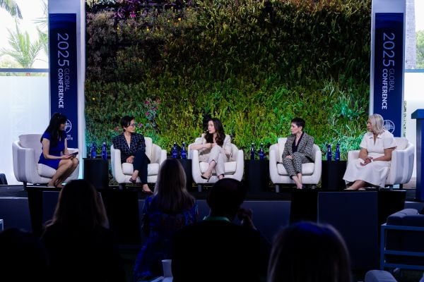 An image of various speakers. Left to right: Sheryl WuDunn, cofounder, FullSky Partners, co-owner, Kristof Wines (moderator); Sheila Marcelo, CEO and cofounder, Ohai.ai; Lauren Miller Rogen, filmmaker, cofounder, Hilarity for Charity (HFC); Penny Pennington, manager, Ohai.ai , partner, Edward Jones; Michele Trogni, CEO, Zinnia