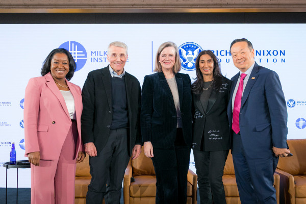 A group of people standing at a conference