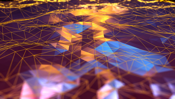 Miniature figure standing on wet pavement reflecting golden city lights at night