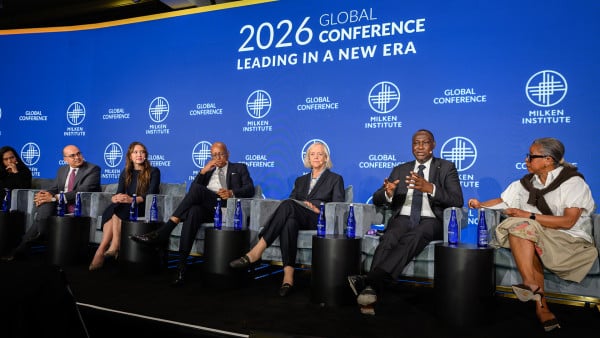 Panel discussion at 2026 FIFA World Cup event with speakers seated on stage