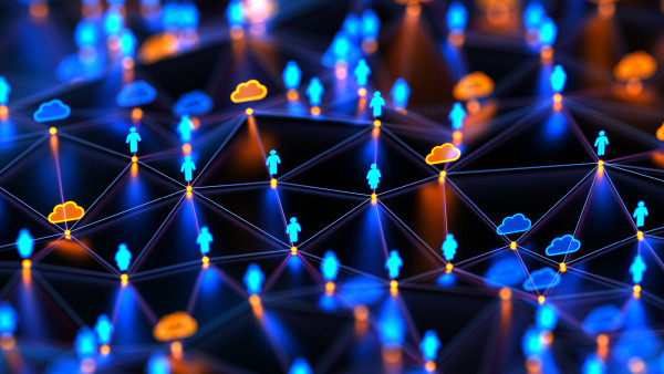 Miniature figurines illuminated with blue and orange lighting creating a crowd scene