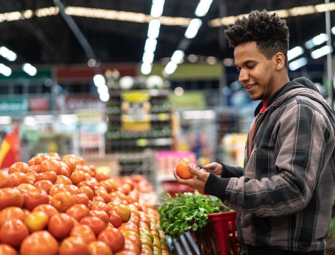 man shopping for produce