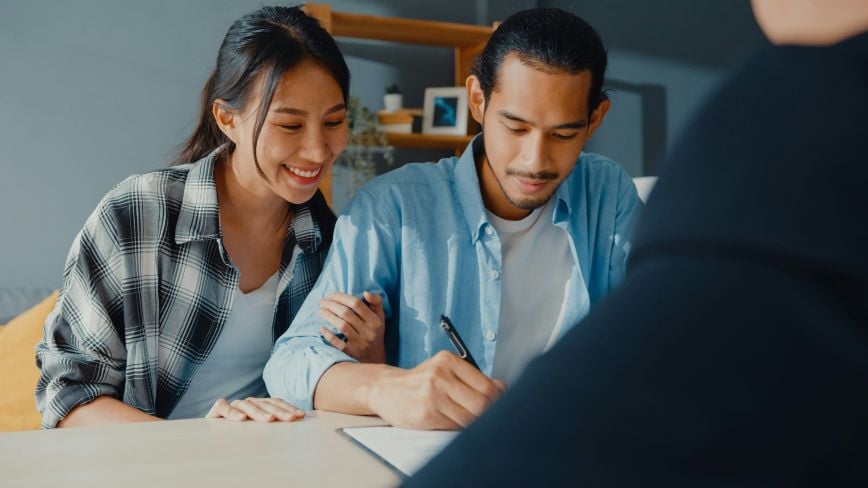 a couple looking over financial documents