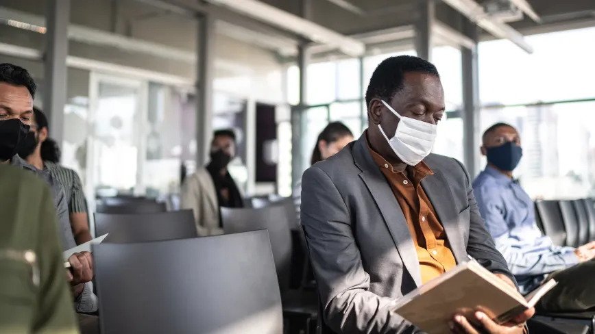 man sitting at airport terminal