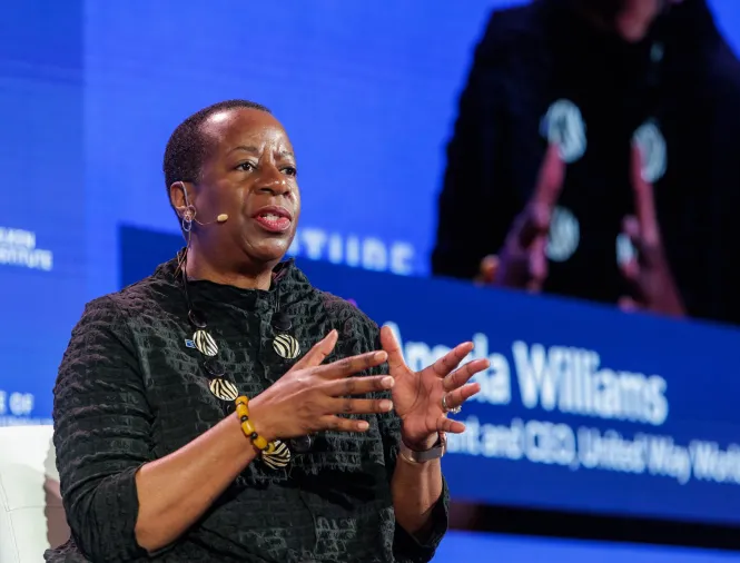 woman on stage speaking