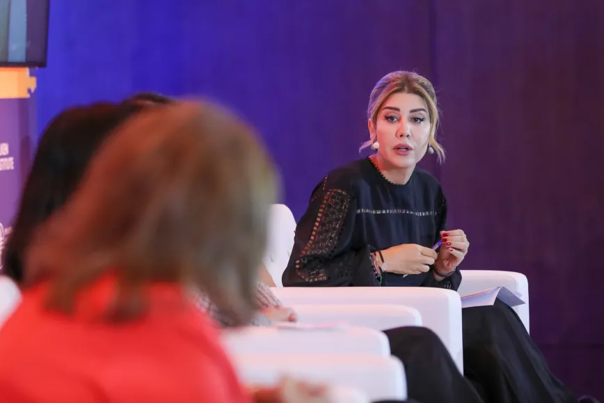 woman speaking on stage