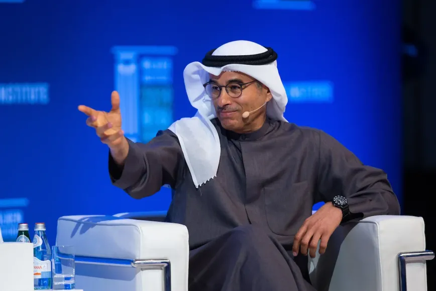 man sitting in a chair gesturing