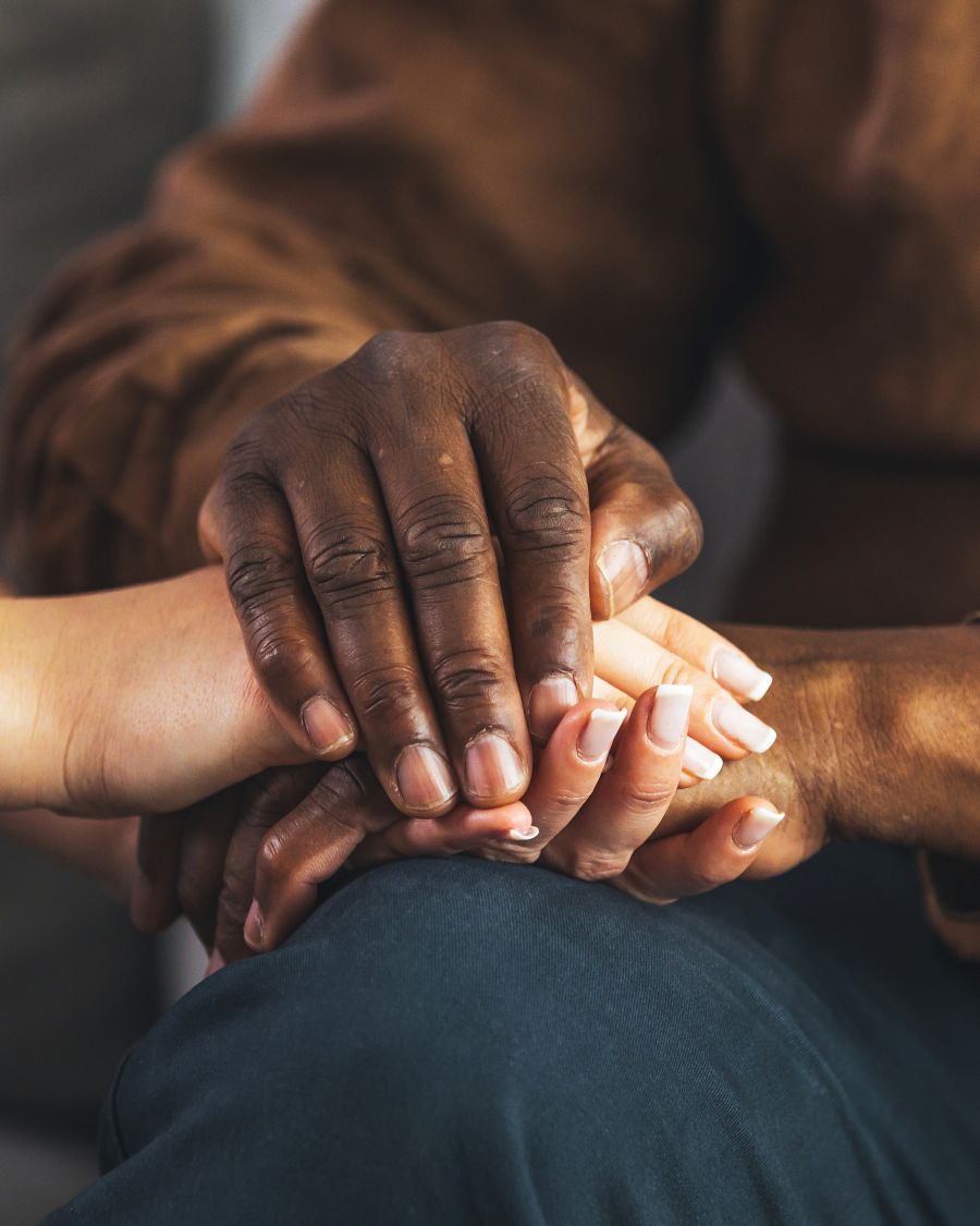 Two people holding hands