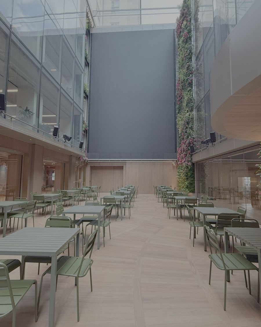 Café seating along the Atrium, facing the living wall