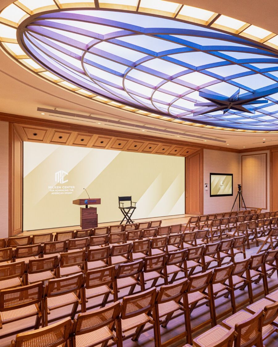 The Multipurpose Room set theater-style beneath a blue-lit circular skylight