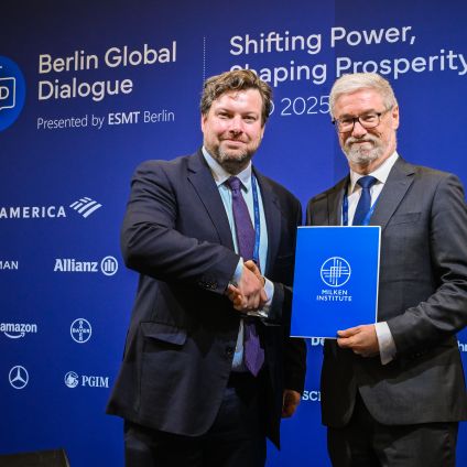 Berlin Global Dialogue shaking hands.