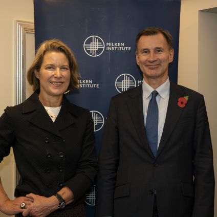 Photo of two Milken Institute Event attendees.