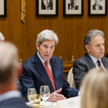 Photo of speakers from the Milken Institute