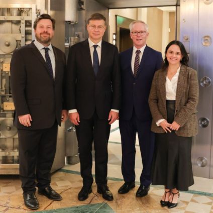 Photo of speakers from the Milken Institute