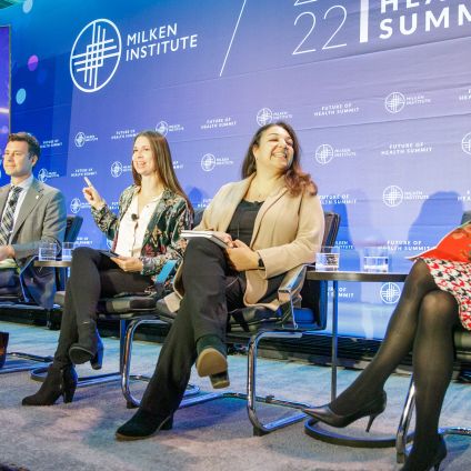 Panel of five women seated on stage at Global Health Summit discussing healthcare topics