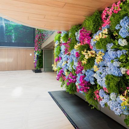 The Atrium corridor, with the floral living wall opposite the digital waterfall