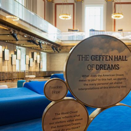 Bronze medallions and lounge seating at the entrance to the Hall of Dreams