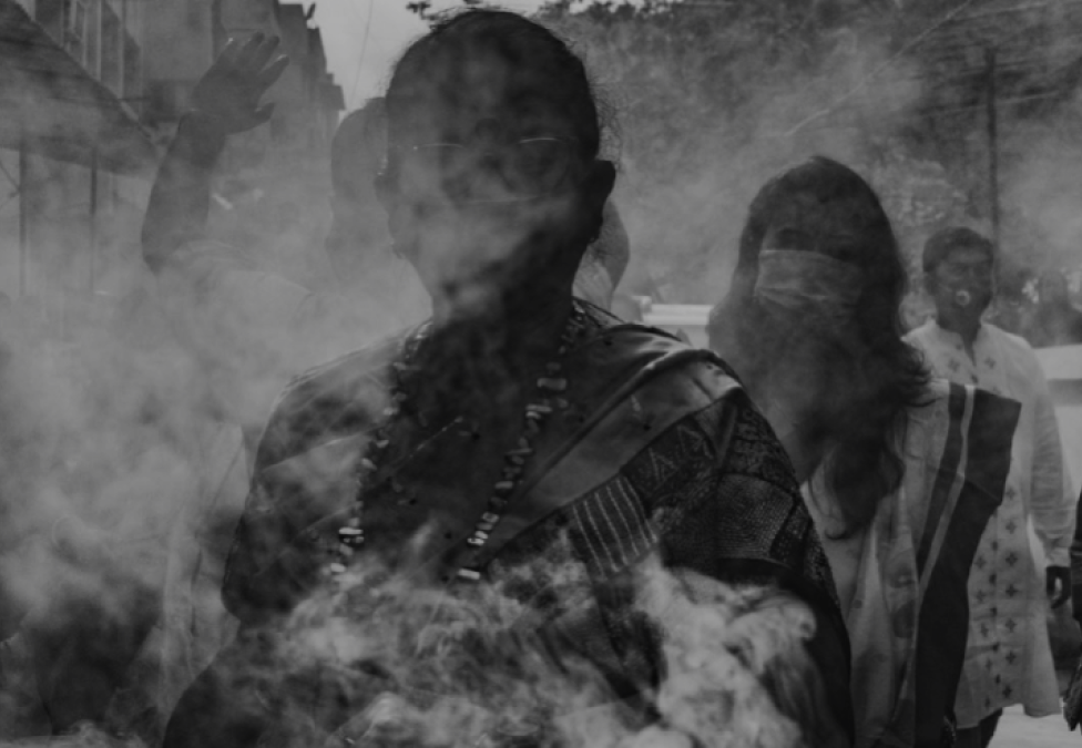 outlines of people in smoke