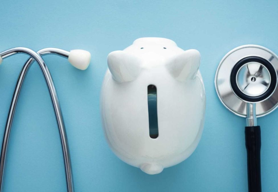 piggy bank and stethoscope