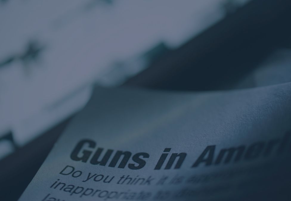 newspaper clipping of an article about guns in america