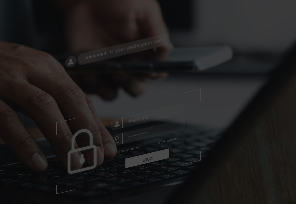 A person entering a password on a computer