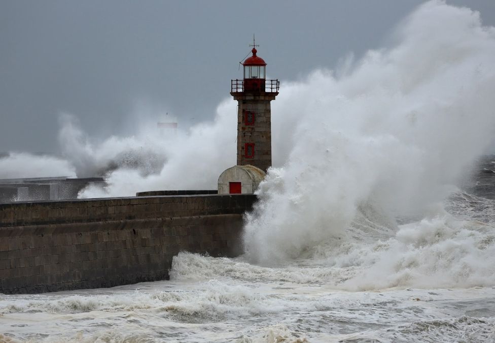 A lighthouse with waves crashing around it