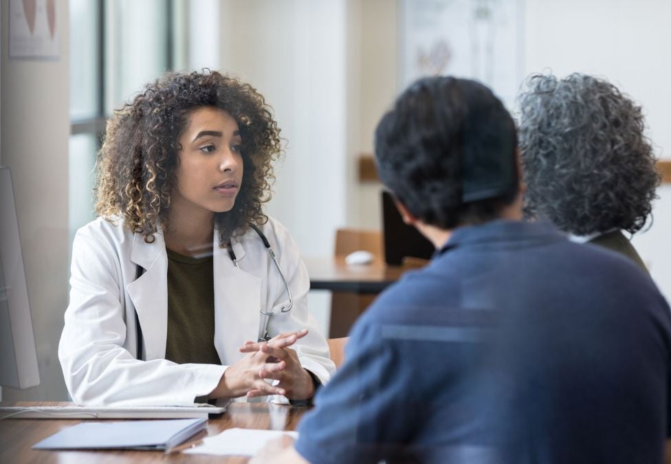 medical professional speaking to people