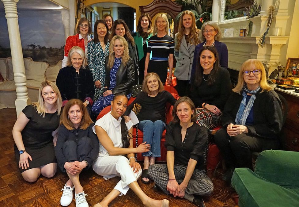 A group photo of a woman named Gloria Steinem and several women from the Milken Institute.