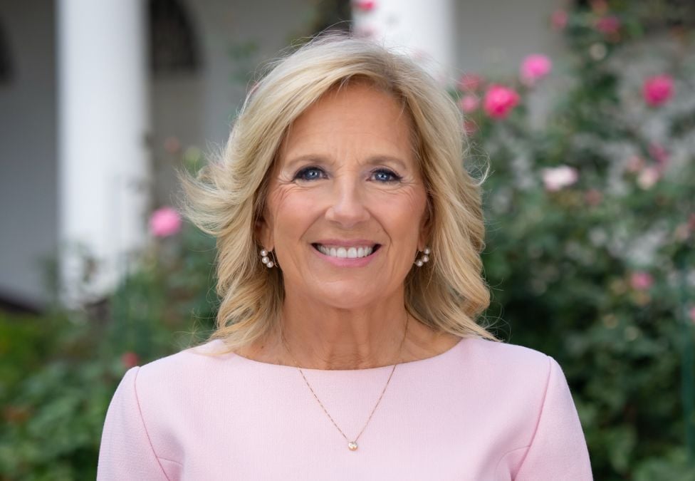 Dr. Jill Biden An image of Dr. Jill Biden. She is a woman with white skin, shoulder-length blonde hair, and she is wearing a pink shirt and smiling at the camera against an outdoor background. The header image leads to an article titled, "Milken Institute Launches New Women’s Health Network, Former First Lady Jill Biden Joins as its Chair".