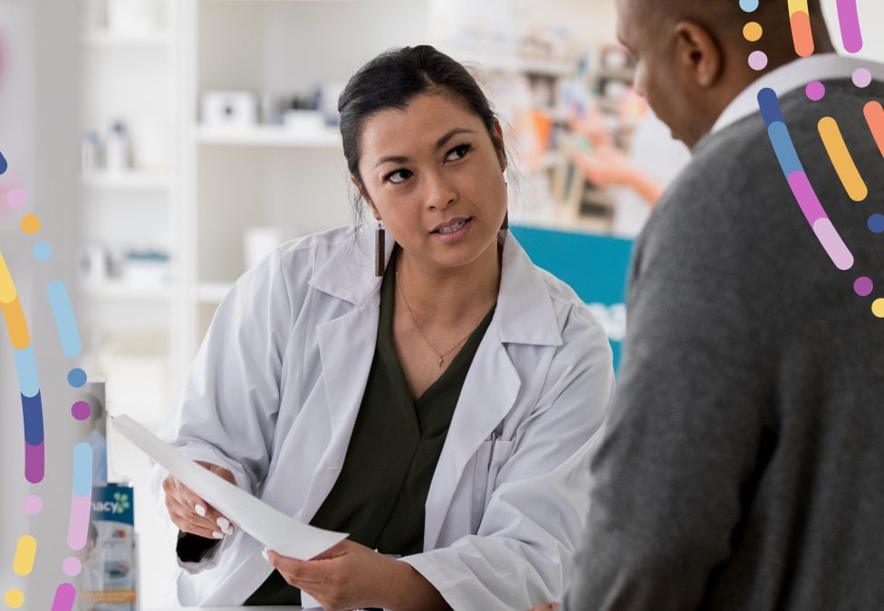 A pharmacist in a white lab coat consults with a patient, holding a clipboard and speaking attentively. They are in a modern pharmacy setting, with medication shelves visible in the background. Colorful abstract graphics overlay the image, symbolizing innovation and access in healthcare.