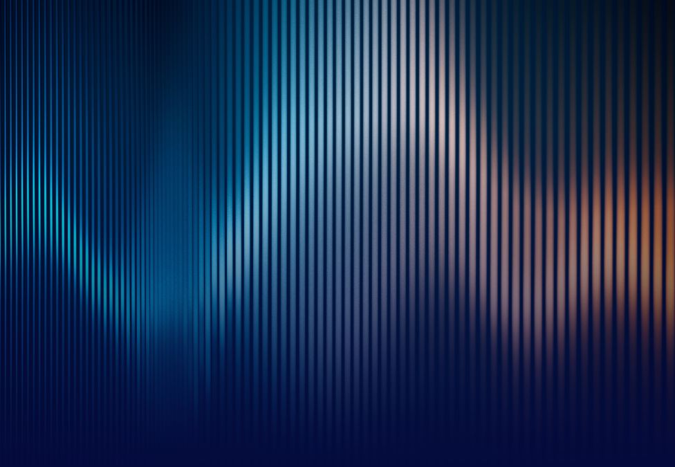 Abstract light pattern in blue and orange tones suggesting data flow or scientific innovation.
